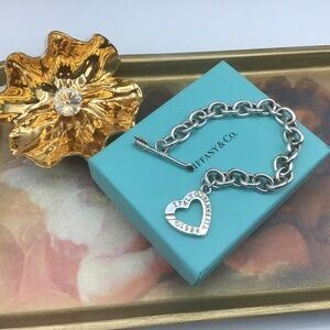 Silver heart and arrow bracelet, marked Italy Tiffany & Co 1984, 8 inches long
